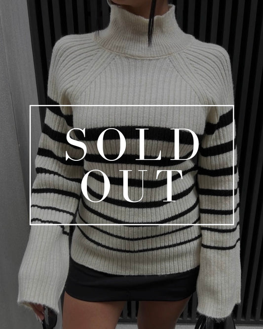Turtleneck Sweater with Bold Striped Accents in Cream