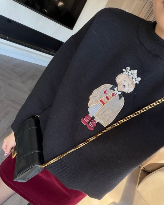 Black Knit Top with Embroidered Graphic Detail | بلوزة سودة بتفصيل مطرز مميز