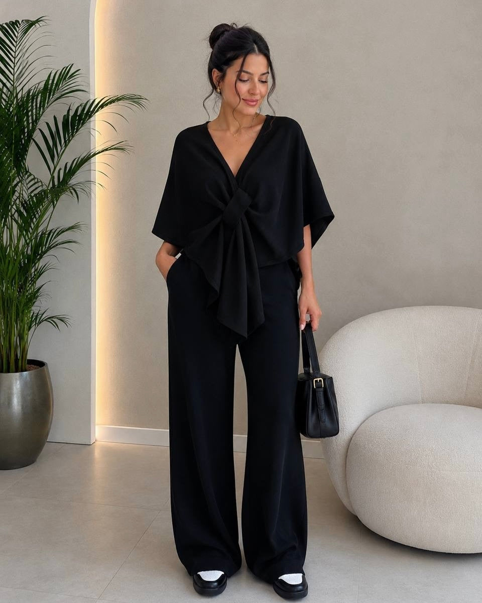 Elegant Black Knit Two-Piece Set with Tie-Front Cape Top | طقم اسود أنيق ببلوزة واسعة مع ربطة أمامية