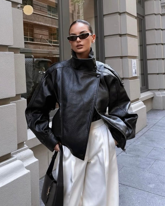 Black Oversized Leather Biker Jacket with High Stand Collar & Snap Buttons | جاكيت جلد أسود أوفر سايز بقصة بايكر وياقة عالية وأزرار كبس