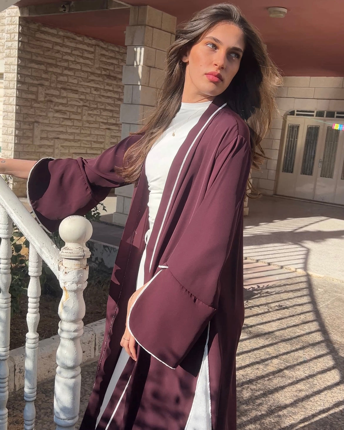 Elegant Maroon Abaya with Floral White Details | عباية أنيقة باللون الخمري مزينة بتفاصيل ورود بيضاء