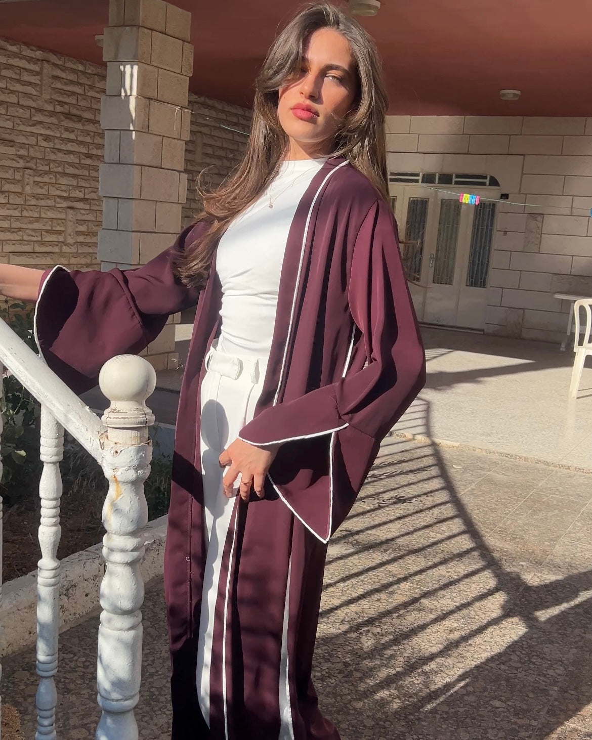 Elegant Maroon Abaya with Floral White Details | عباية أنيقة باللون الخمري مزينة بتفاصيل ورود بيضاء