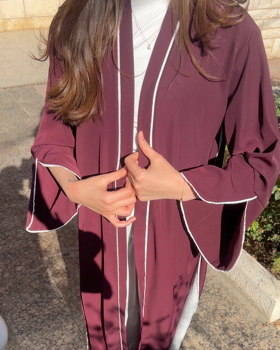 Elegant Maroon Abaya with Floral White Details | عباية أنيقة باللون الخمري مزينة بتفاصيل ورود بيضاء