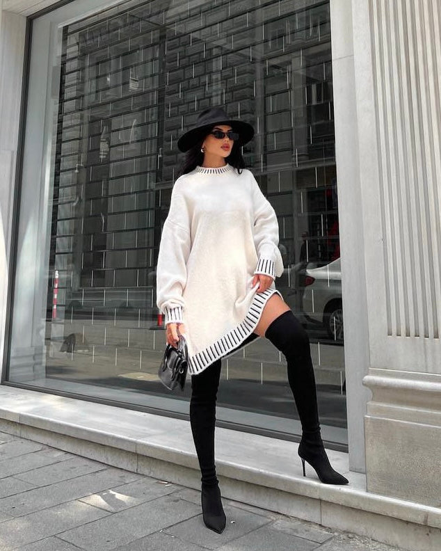 بلوزة طويلة بلون كريمي مع تفاصيل بلون الاسود