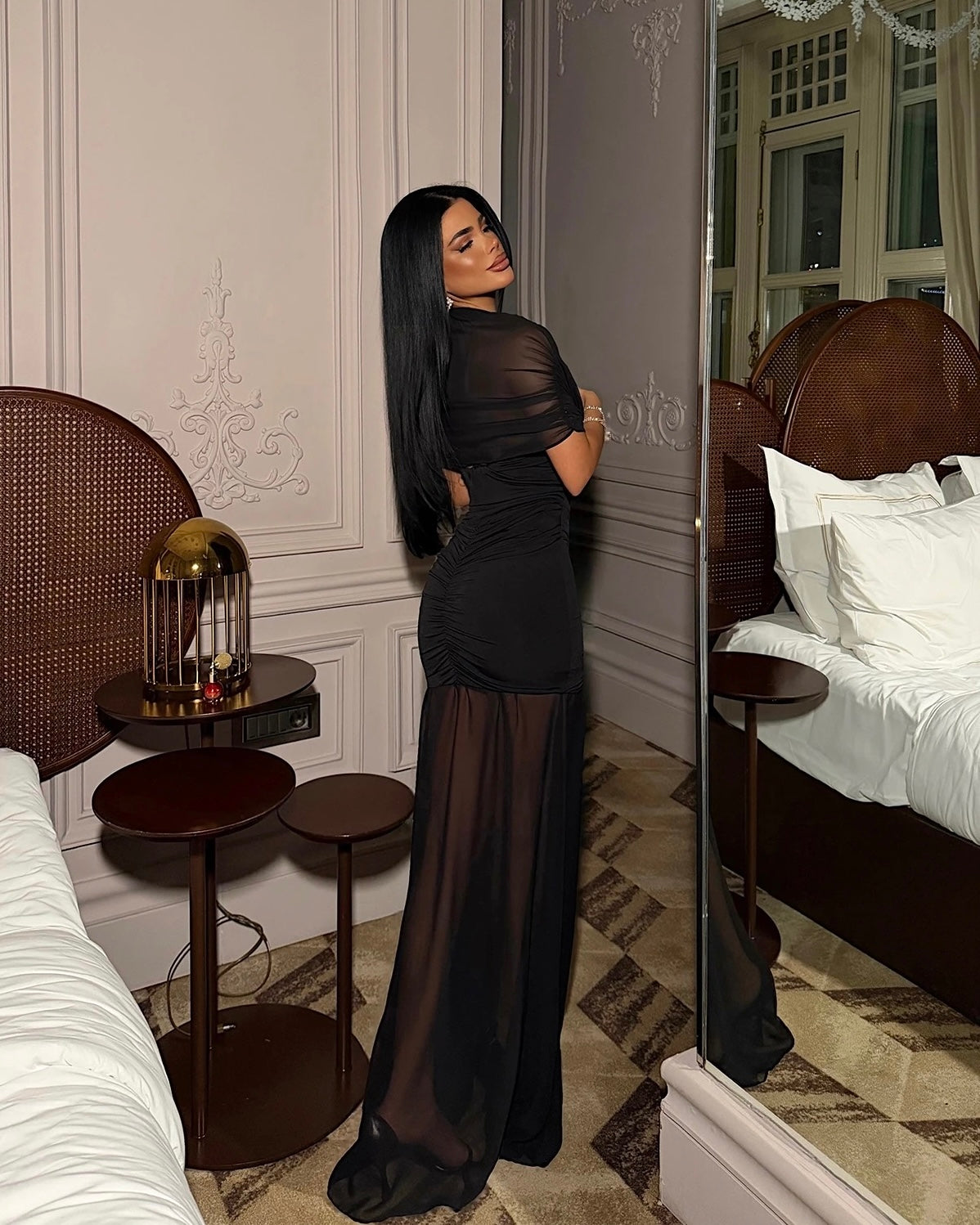 Black Elegant Sheer Bodycon Dress with a Flowy Hem | فستان أسود أنيق بتصميم شفاف وقصة ضيقة