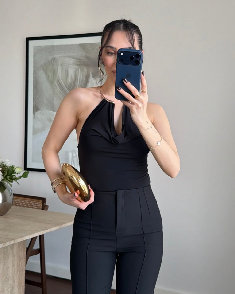 Elegant Black Halter Neck Top with Gold Hardware Detail | توب أسود أنيق بياقة هالتر وتفصيلة معدنية ذهبية