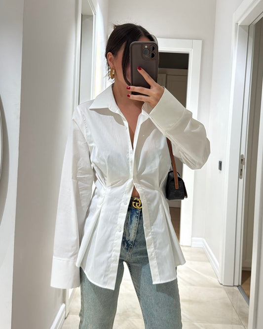 White Tailored Button-Down Shirt with Sculpted Waist & Wide Cuffs | بلوزة بأزرار بتصميم منحوت وأكمام واسعة باللون الابيض