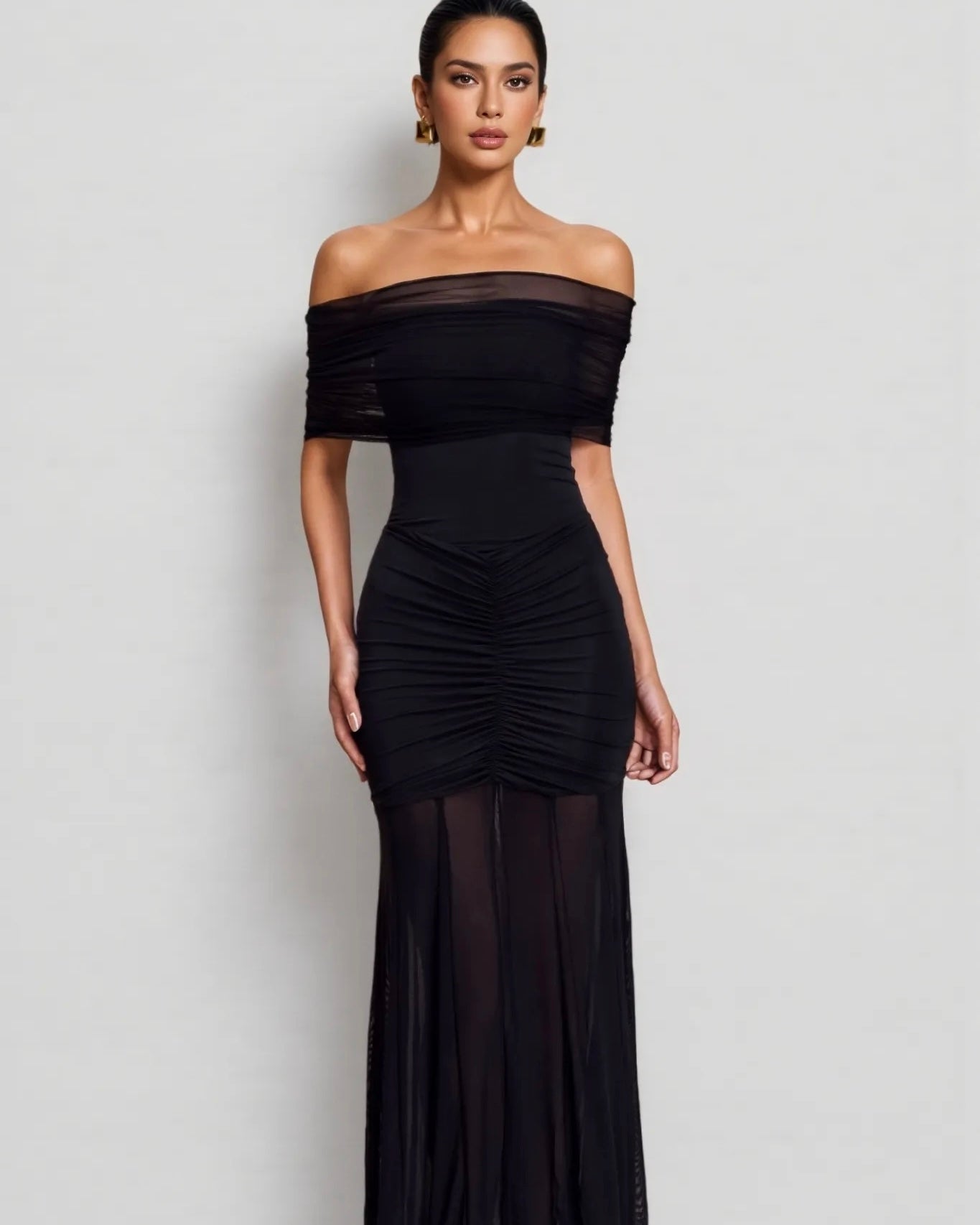 Black Elegant Sheer Bodycon Dress with a Flowy Hem | فستان أسود أنيق بتصميم شفاف وقصة ضيقة
