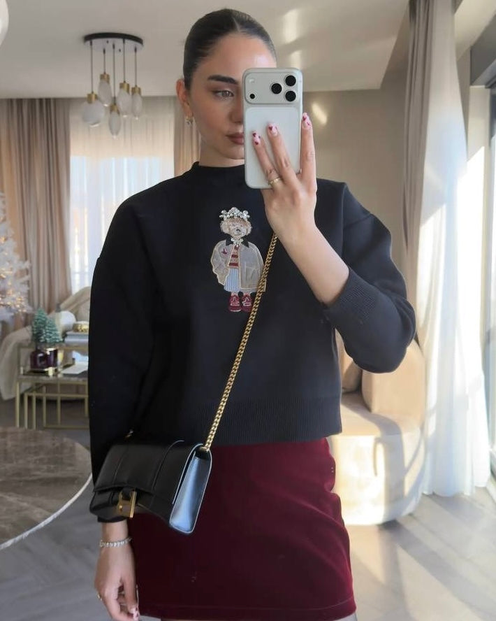 Black Knit Top with Embroidered Graphic Detail | بلوزة سودة بتفصيل مطرز مميز