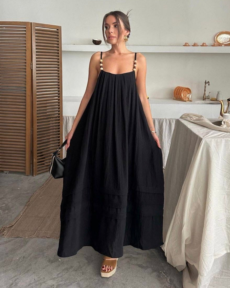 Flowy Black Dress with Straps Adorned with Feminine Details | فستان أسود واسع