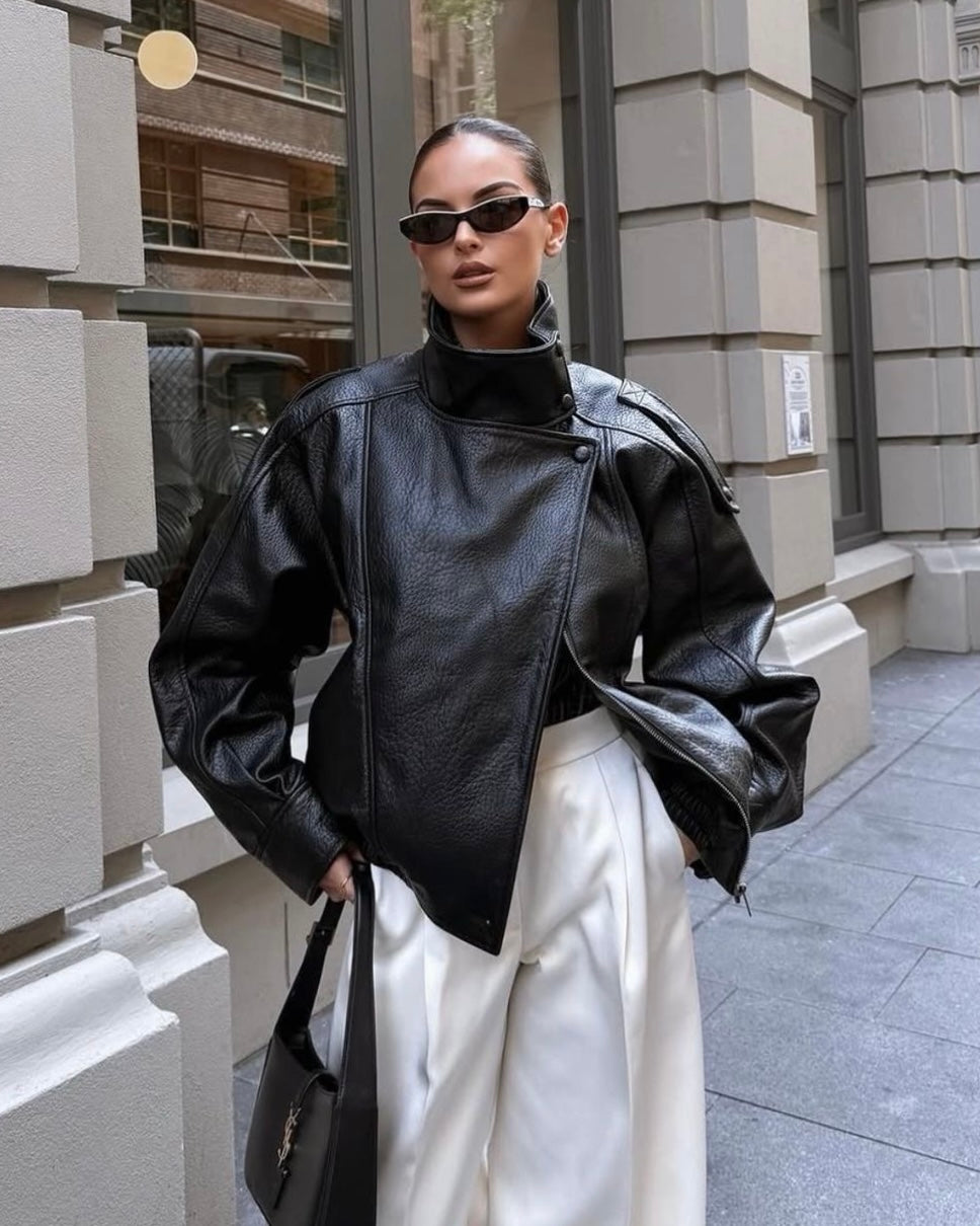 Black Oversized Leather Biker Jacket with High Stand Collar & Snap Buttons | جاكيت جلد أسود أوفر سايز بقصة بايكر وياقة عالية وأزرار كبس
