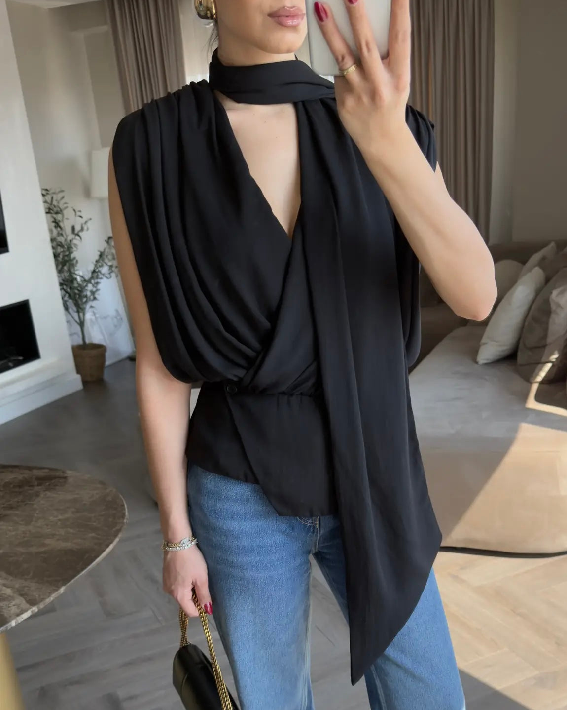Elegant Black Draped Sleeveless Blouse with Scarf Detail | بلوزة سودة أنيقة بقصة درابيه وياقة شال