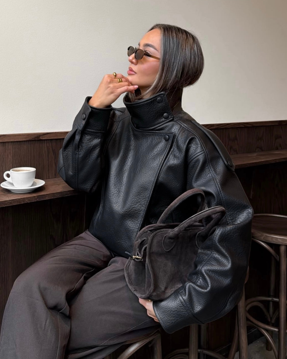 Black Oversized Leather Biker Jacket with High Stand Collar & Snap Buttons | جاكيت جلد أسود أوفر سايز بقصة بايكر وياقة عالية وأزرار كبس