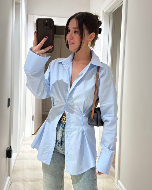 Baby Blue Tailored Button-Down Shirt with Sculpted Waist & Wide Cuffs | بلوزة بأزرار بتصميم منحوت وأكمام واسعة باللون الازرق البارد