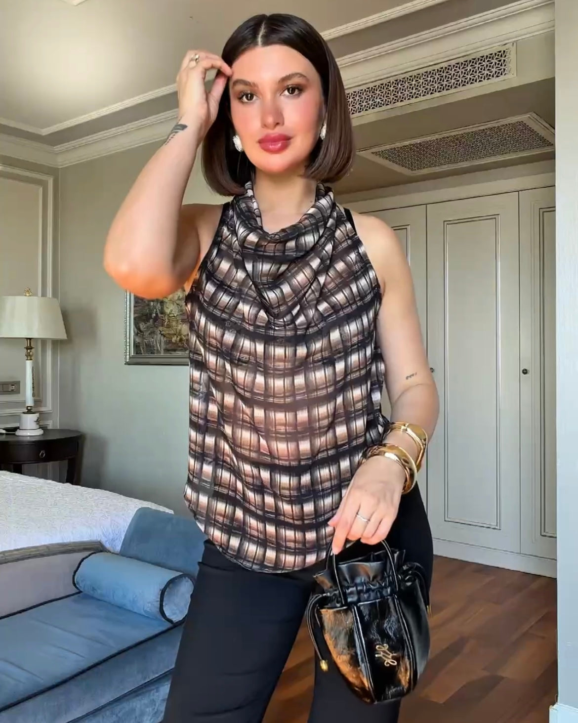 Brown Plaid Sleeveless Blouse with Draped Neck | بلوزة كاروهات بنية أنيقة بياقة منسدلة بدون أكمام