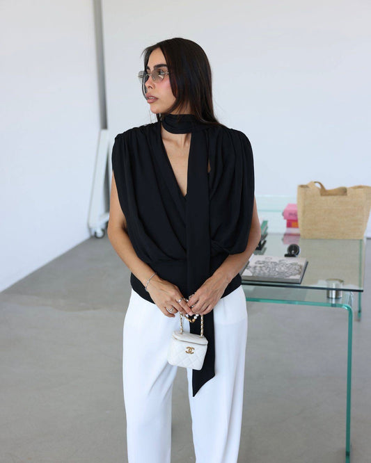 Elegant Black Draped Sleeveless Blouse with Scarf Detail | بلوزة سودة أنيقة بقصة درابيه وياقة شال