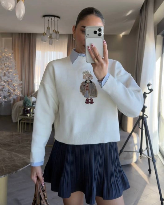 Ivory Knit Top with Embroidered Graphic Detail | بلوزة أوف وايت بتفصيل مطرز مميز