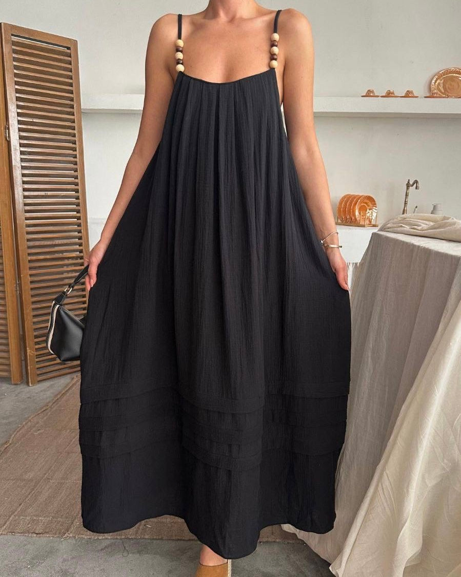 Flowy Black Dress with Straps Adorned with Feminine Details | فستان أسود واسع