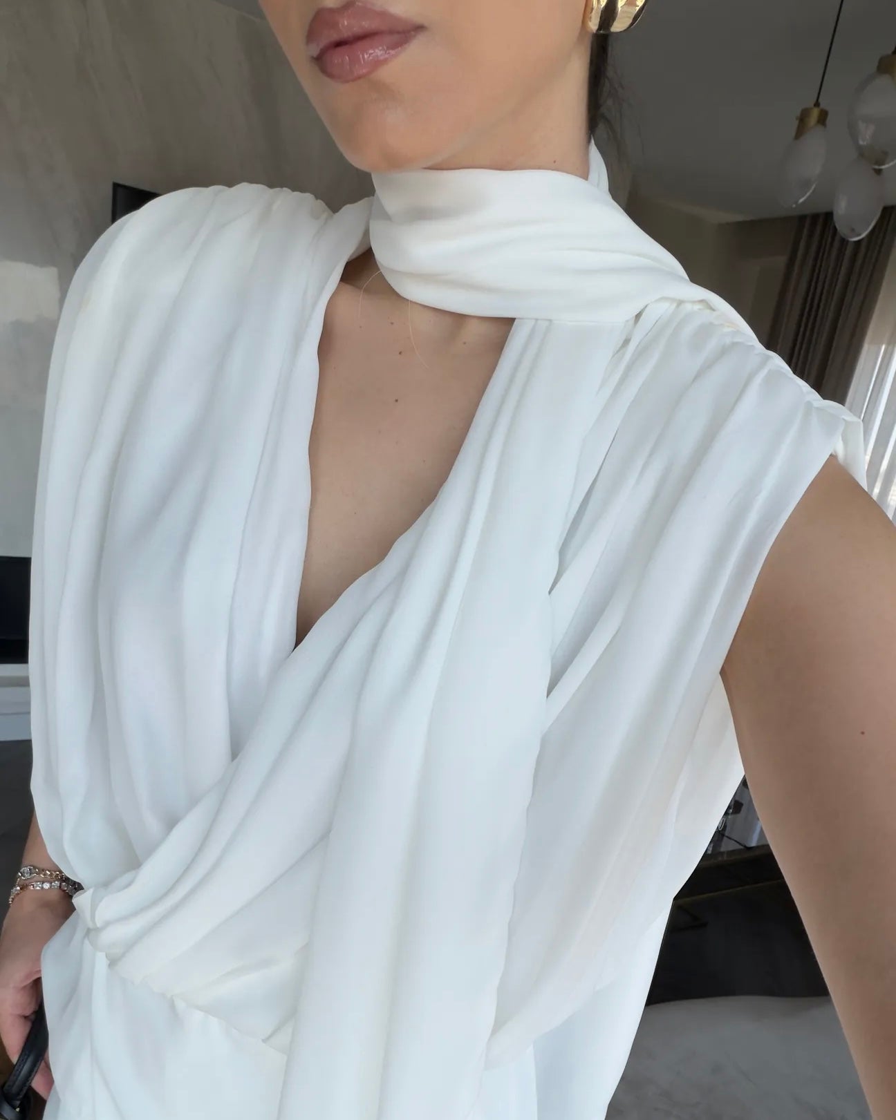 Elegant White Draped Sleeveless Blouse with Scarf Detail | بلوزة بيضا أنيقة بقصة درابيه وياقة شال