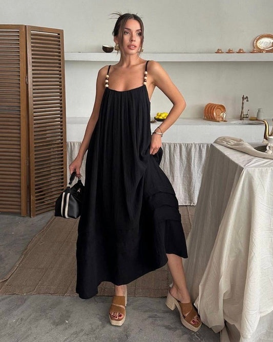 Flowy Black Dress with Straps Adorned with Feminine Details | فستان أسود واسع