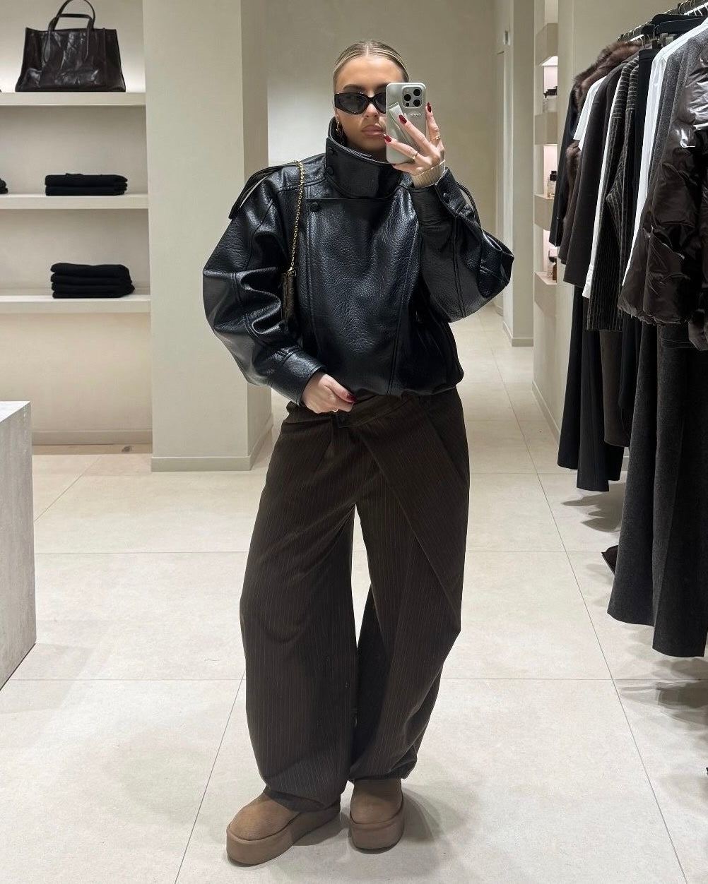 Black Oversized Leather Biker Jacket with High Stand Collar & Snap Buttons | جاكيت جلد أسود أوفر سايز بقصة بايكر وياقة عالية وأزرار كبس