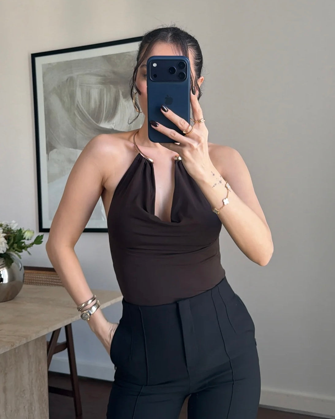 Elegant Black Halter Neck Top with Gold Hardware Detail | توب أسود أنيق بياقة هالتر وتفصيلة معدنية ذهبية