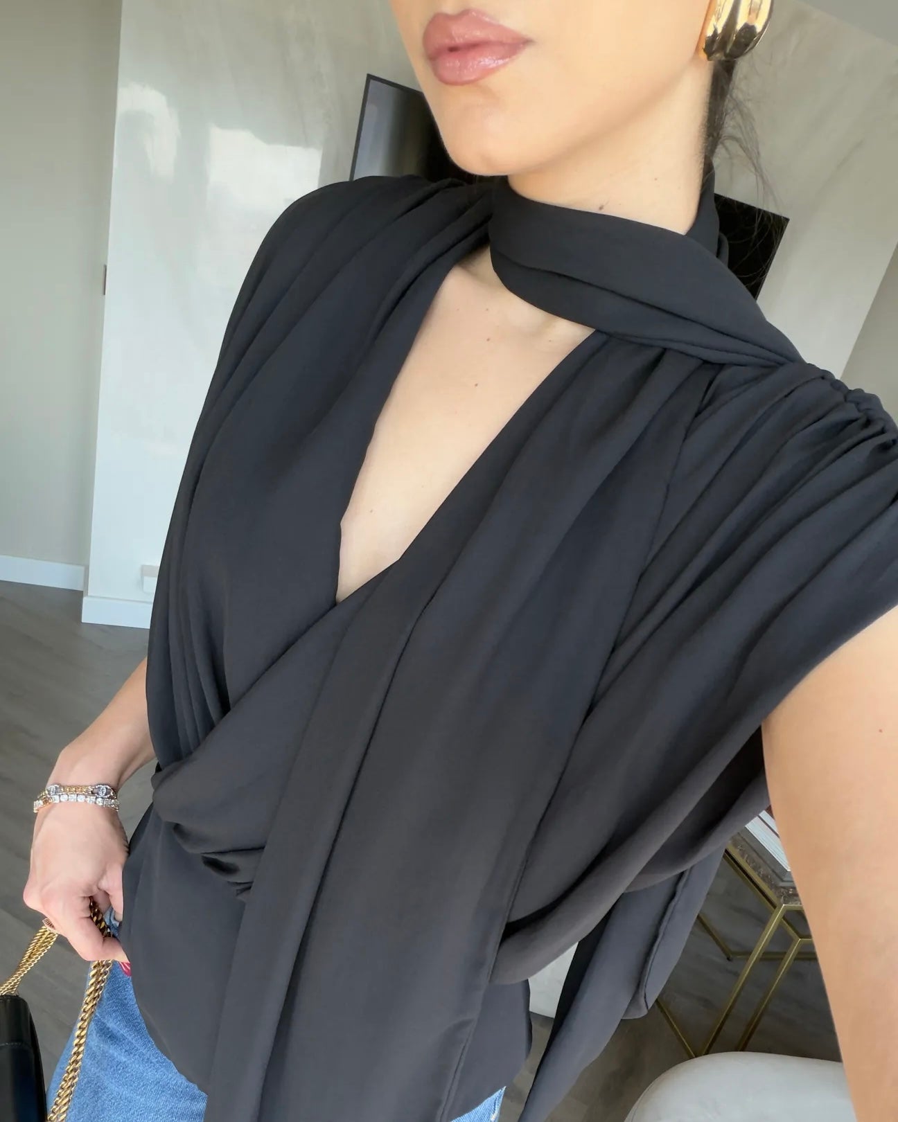 Elegant Black Draped Sleeveless Blouse with Scarf Detail | بلوزة سودة أنيقة بقصة درابيه وياقة شال