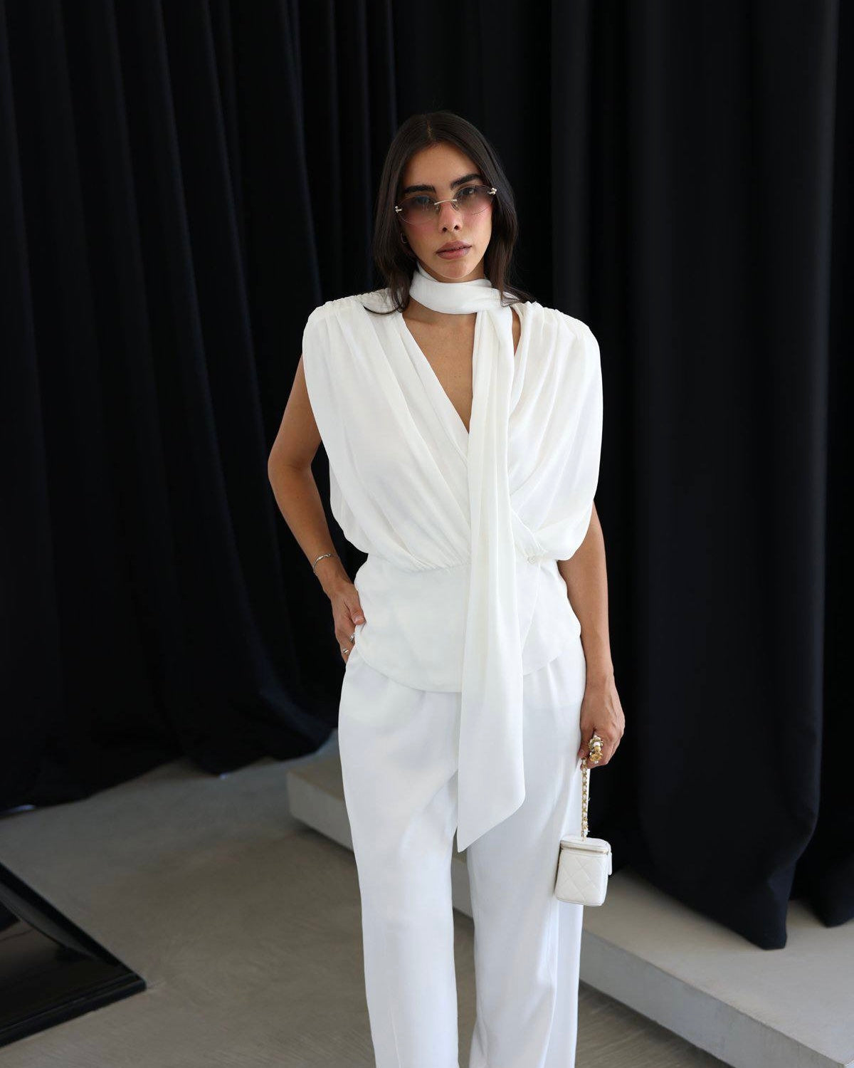 Elegant White Draped Sleeveless Blouse with Scarf Detail | بلوزة بيضا أنيقة بقصة درابيه وياقة شال