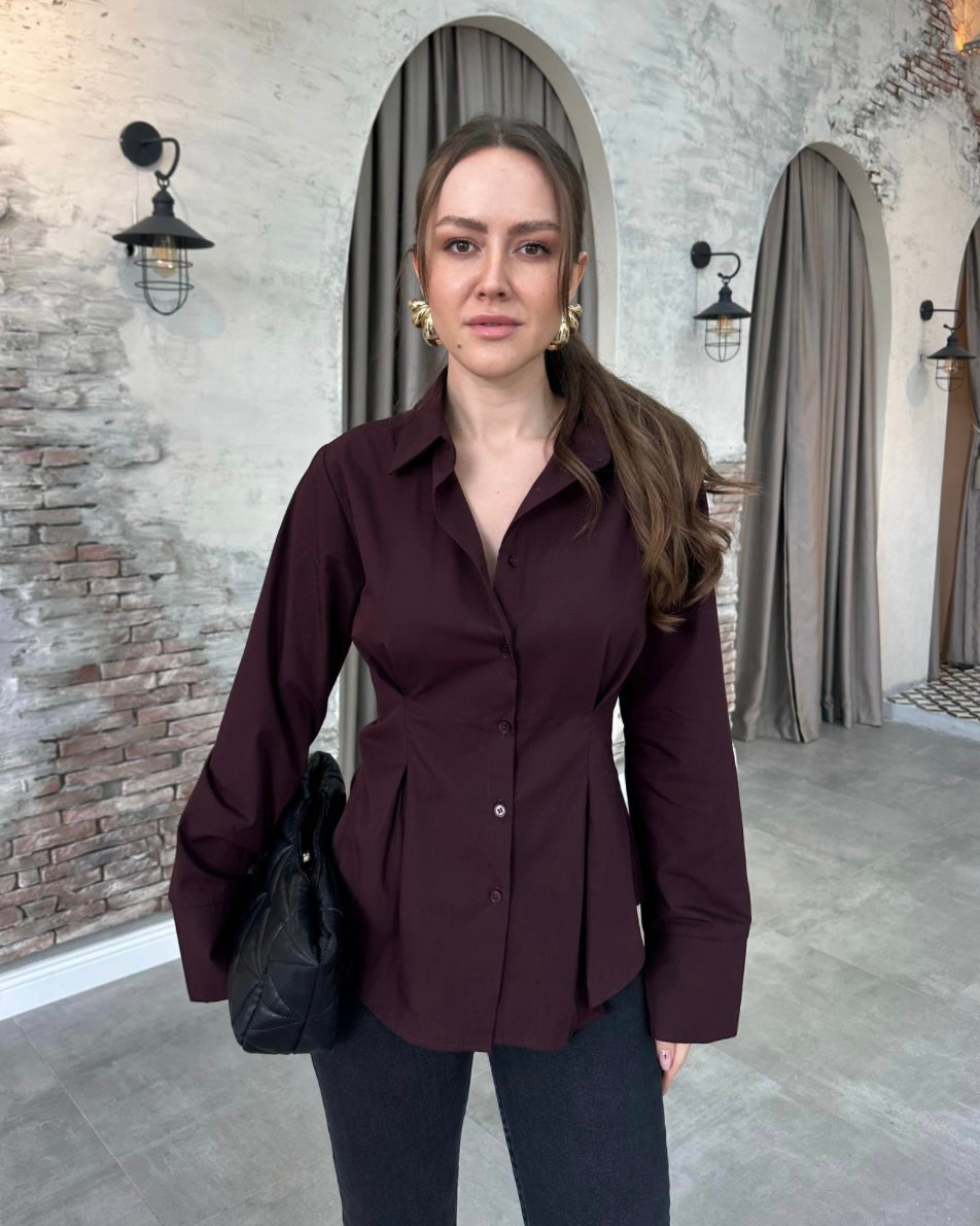 Burgundy Tailored Button-Down Shirt with Sculpted Waist & Wide Cuffs | بلوزة بأزرار بتصميم منحوت وأكمام واسعة باللون الخمري