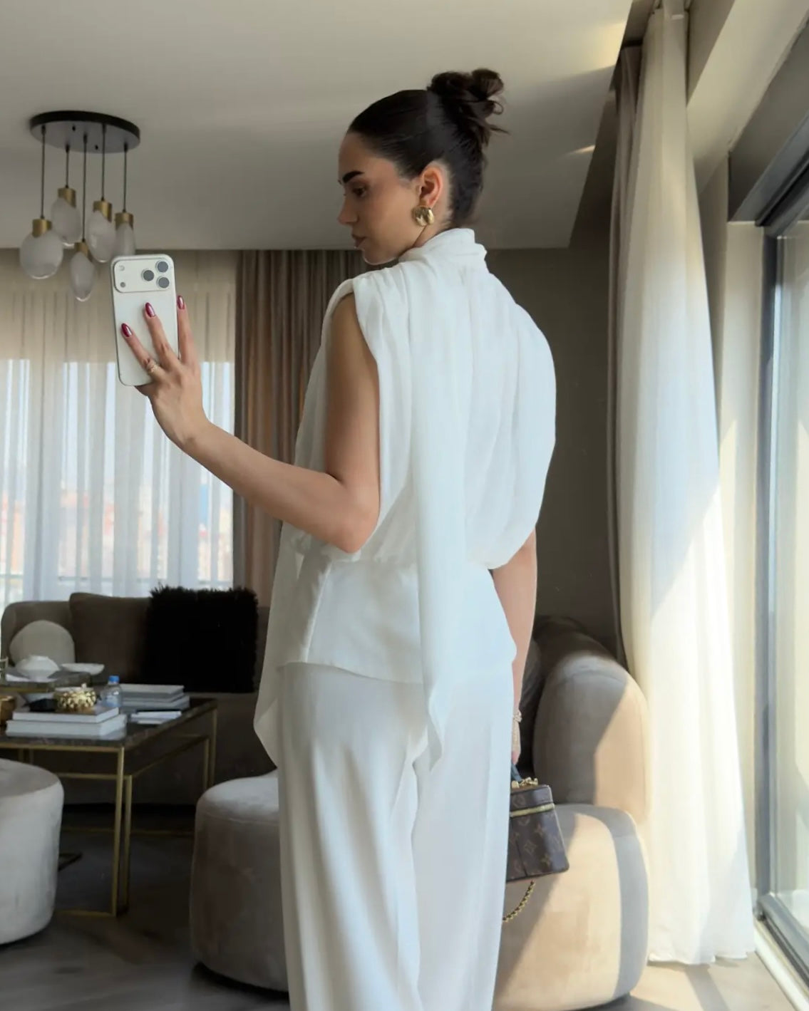 Elegant White Draped Sleeveless Blouse with Scarf Detail | بلوزة بيضا أنيقة بقصة درابيه وياقة شال