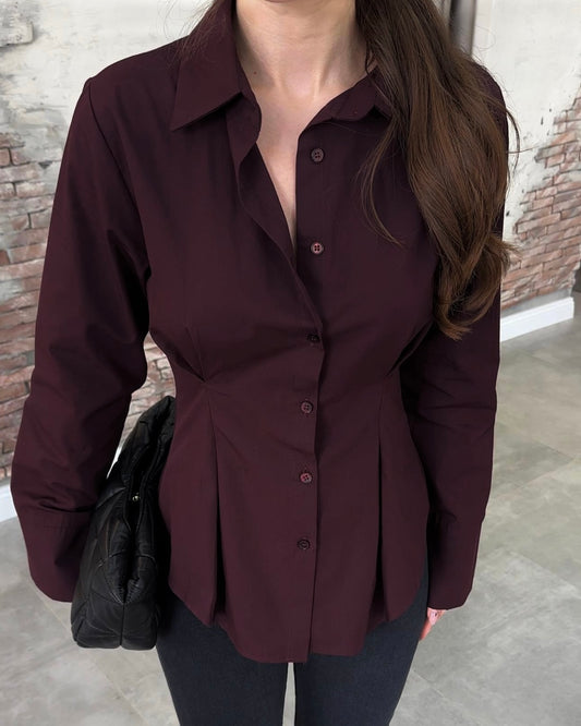 Burgundy Tailored Button-Down Shirt with Sculpted Waist & Wide Cuffs | بلوزة بأزرار بتصميم منحوت وأكمام واسعة باللون الخمري